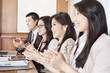 Business people clapping their hands