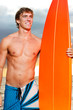 Professional Surfer holding a Surf Board