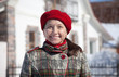 mature woman against real estate in winter mature woman against real estate in winter