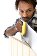Carpenter sawing wood
