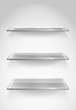 Three empty advertising glass shelves on the wall Three empty advertising glass shelves on the wall
