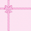 Gift bow and ribbon on pink polka dot background