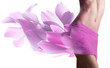 Beautiful woman with petals  on her hips