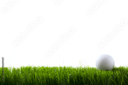 Photo: Golf ball on green grass Golf ball on green grass