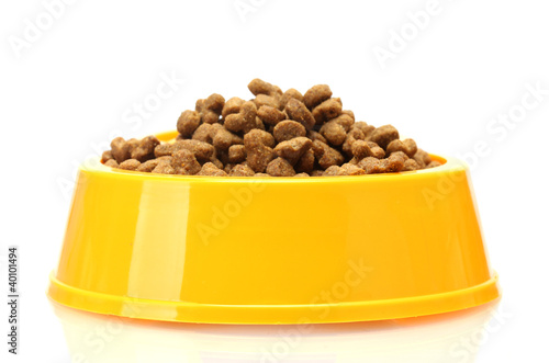 Photo: dry cat food in yellow bowl isolated on white dry cat food in yellow bowl isolated on white