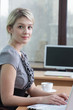 Business woman using laptop in office