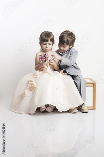 Photo: Two beautiful boys and girls in wedding dresses Two beautiful boys and girls in wedding dresses
