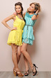 Two beautiful women in summer dresses.