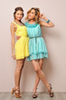 Two beautiful women in summer dresses.