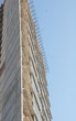 Apartment building construction against blue sky