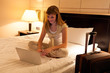 Young woman using laptop in hotel Young woman using laptop in hotel