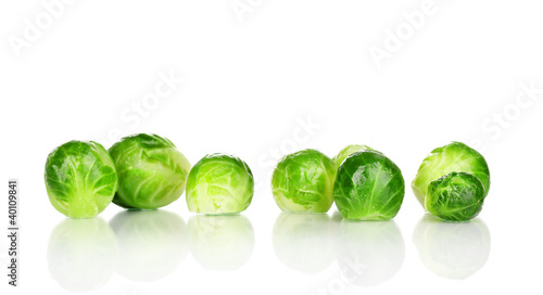 Photo: Fresh brussels sprouts isolated on white Fresh brussels sprouts isolated on white