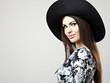 Romantic Beauty in black hat. Retro Style photo.
