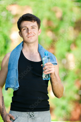 Photo: Man drinking water after fitness Man drinking water after fitness