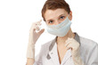 Nurse putting on medical mask Nurse putting on medical mask