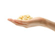 Female hand with yellow pills