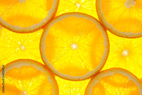 Photo: Orange slices background / macro / back lit Orange slices background / macro / back lit