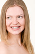Photo: Beautiful young girl with brackets on teeth Beautiful young girl with brackets on teeth
