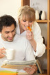 young happy couple having breakfast