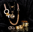 Golden jewelry on black background