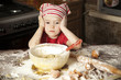 little chef in the kitchen wearing an apron and headscarf