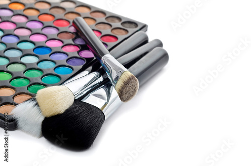 Photo: Multi colored make-up and brushes Multi colored make-up and brushes