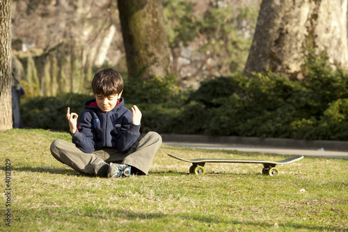 Photo: baby do yoga in a meadow baby do yoga in a meadow