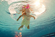 swimming under the water girl with flower