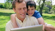 Father and son looking at an ebook