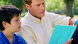Father and son reading a fascinating book