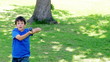 Smiling boy playing baseball with his father