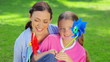 Video: Mother and daughter holding pinwheels Mother and daughter holding pinwheels