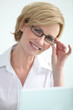 Secretary holding glasses.