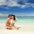 Young couple on the beach of sea