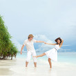 Young couple on the beach of sea