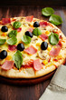 Pizza with ham, pepper and olives