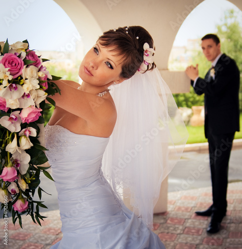 Photo: The bride looks into the distance The bride looks into the distance