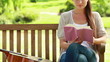 Video: Woman reading a book with a guitar next to her Woman reading a book with a guitar next to her