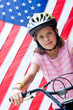 Foto: American flag and girl on bike American flag and girl on bike