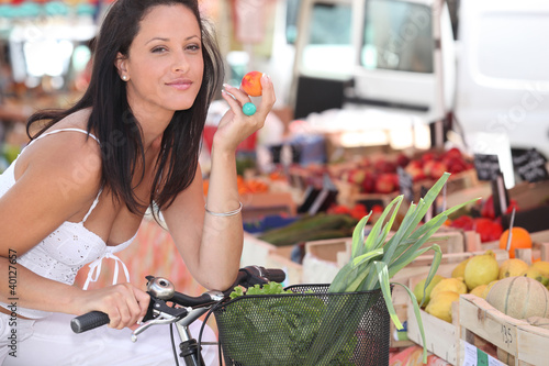 Photo: Woman shopping at local market Woman shopping at local market