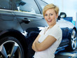 Photo: Pretty woman is happy with the service in a garage Pretty woman is happy with the service in a garage
