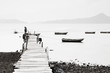 Lonely pier along the coast, low saturation image. Lonely pier along the coast, low saturation image.