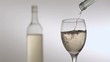 White wine in super slow motion filling a glass