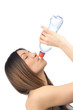 Closeup photo of young woman drinking water from bottle