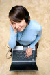Happy girl listening music from laptop Happy girl listening music from laptop