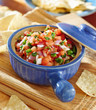 bowl of salsa with tortilla chips.