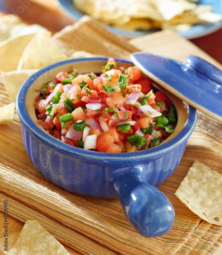 Photo: bowl of salsa with tortilla chips. bowl of salsa with tortilla chips.
