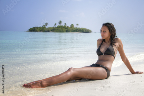 Photo: Sexy pretty young girl lying on the beach (Maldives / Malediven) Sexy pretty young girl lying on the beach (Maldives / Malediven)