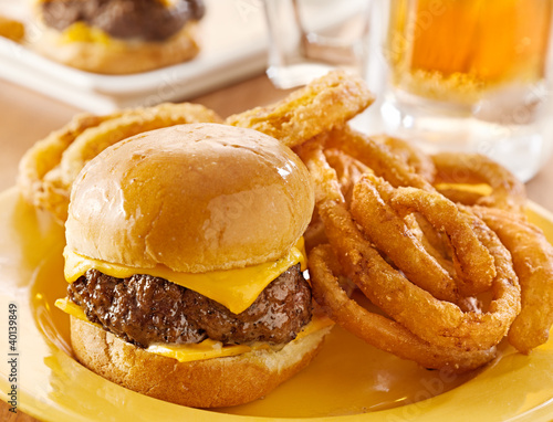 Photo: burger slider with onion rings and beer closeup burger slider with onion rings and beer closeup