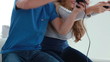 Happy couple playing video games together